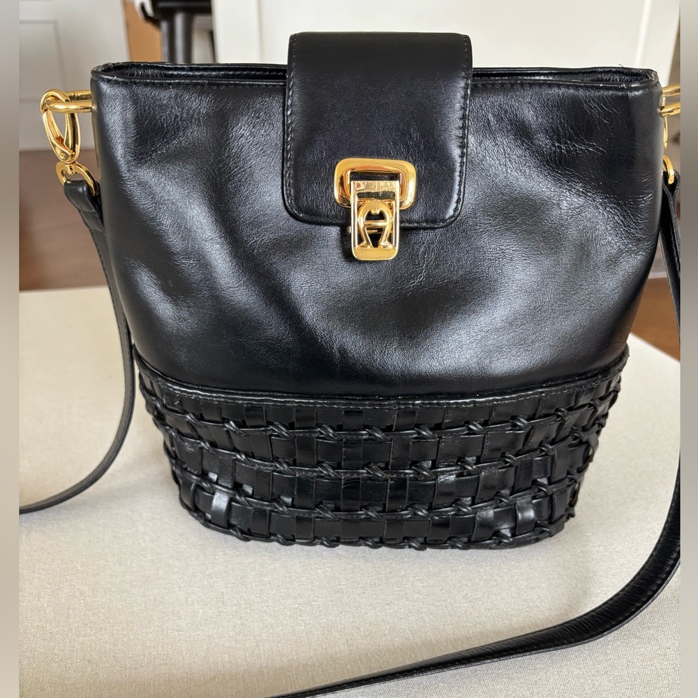 Etienne Aigner leather bucket bag crossbody black gold woven quiet luxury